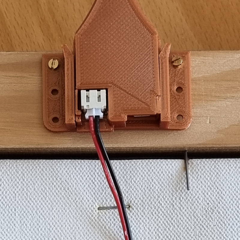 Lamp in holder with battery cable